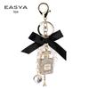 Korean-Style Handmade Rhinestone Perfume Bottle Keychain with Bow and Pearl Charm