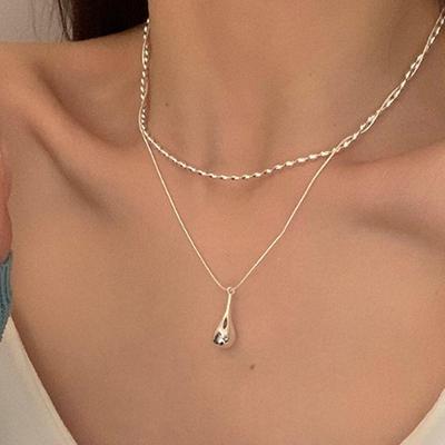 Elegant Double-Layer Water Drop Necklace for Women - Versatile and Trendy Clavicle Chain with Unique Style and Personality.
