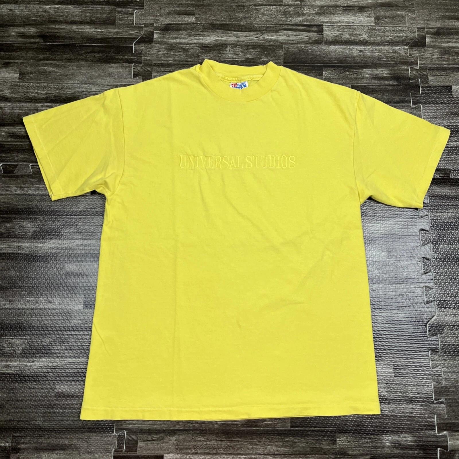 

Vintage 90s Universal Studios Single Stitch Tshirt Yellow Monochrome Spellout L XL