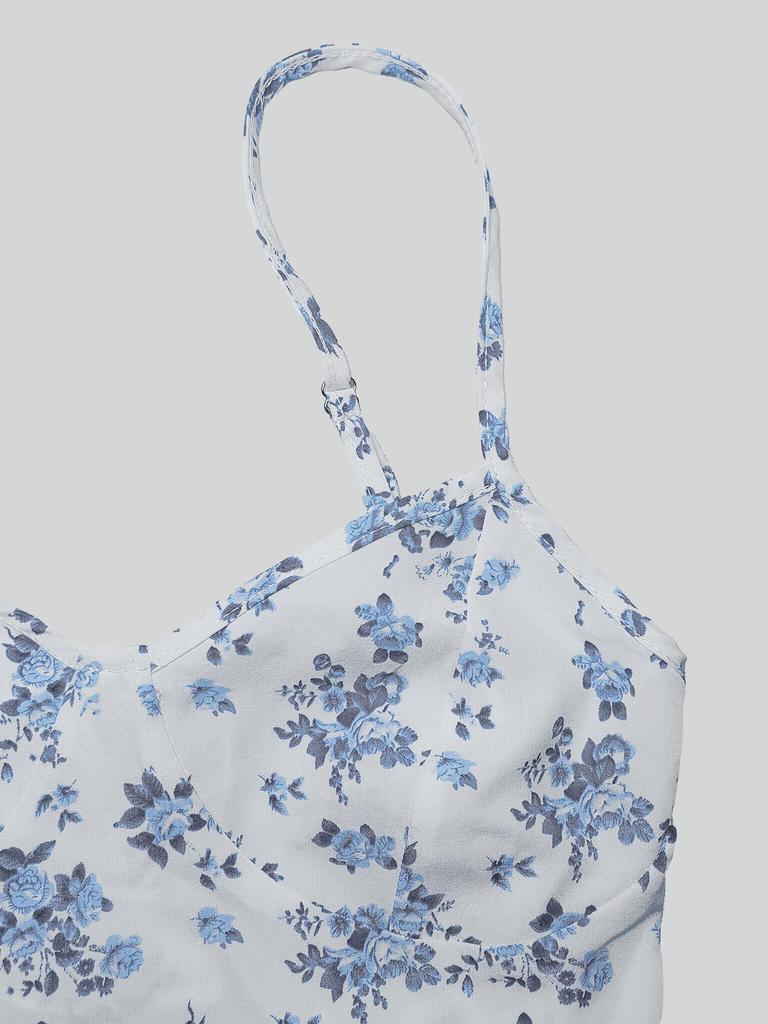 Robe à bretelles spaghetti en dentelle florale à lacets pour femme avec nœud et large ourlet