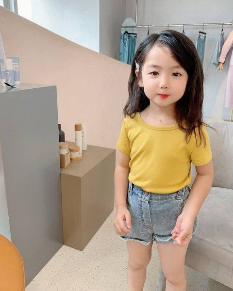 Letni miot dla dzieci dziewczyny śliczna koszulka z kokardką koszulka z odkrytymi plecami koszulka z krótkim rękawem bawełniane topy dziecięce koszulki z wycięciem pod szyją stroje dla dzieci 3-8T