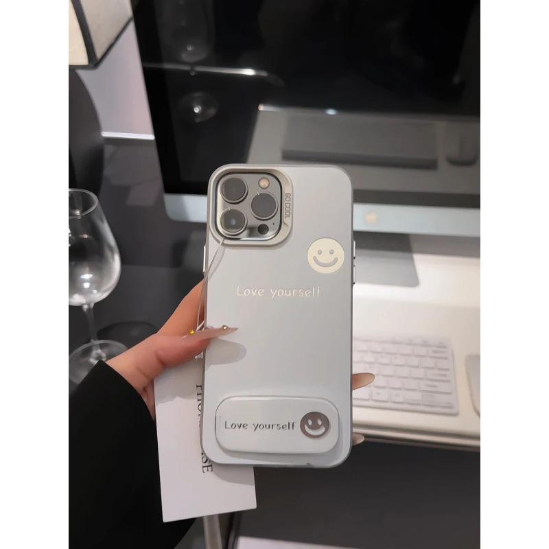Simple English Smiley Face Bracket Is Suitable for Apple 17promax Mobile Phone Case IP16 Color Silver IMD15 Matte 14/xs.