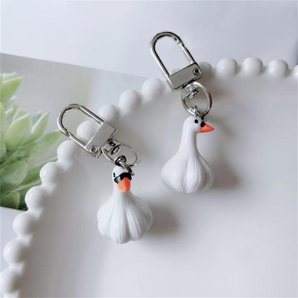 Kreativer Knoblauchförmiger Schlüsselanhänger Knoblauch-Enten-Schlüsselanhänger Blickfangendes Schlüsselzubehör Cartoon-Schlüsselhalter Geeignet für den Alltag