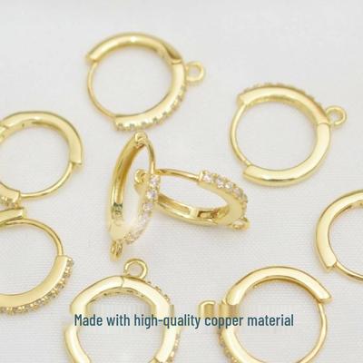Orecchini a cerchio placcati in oro 18 carati con zirconi e clip a pendente