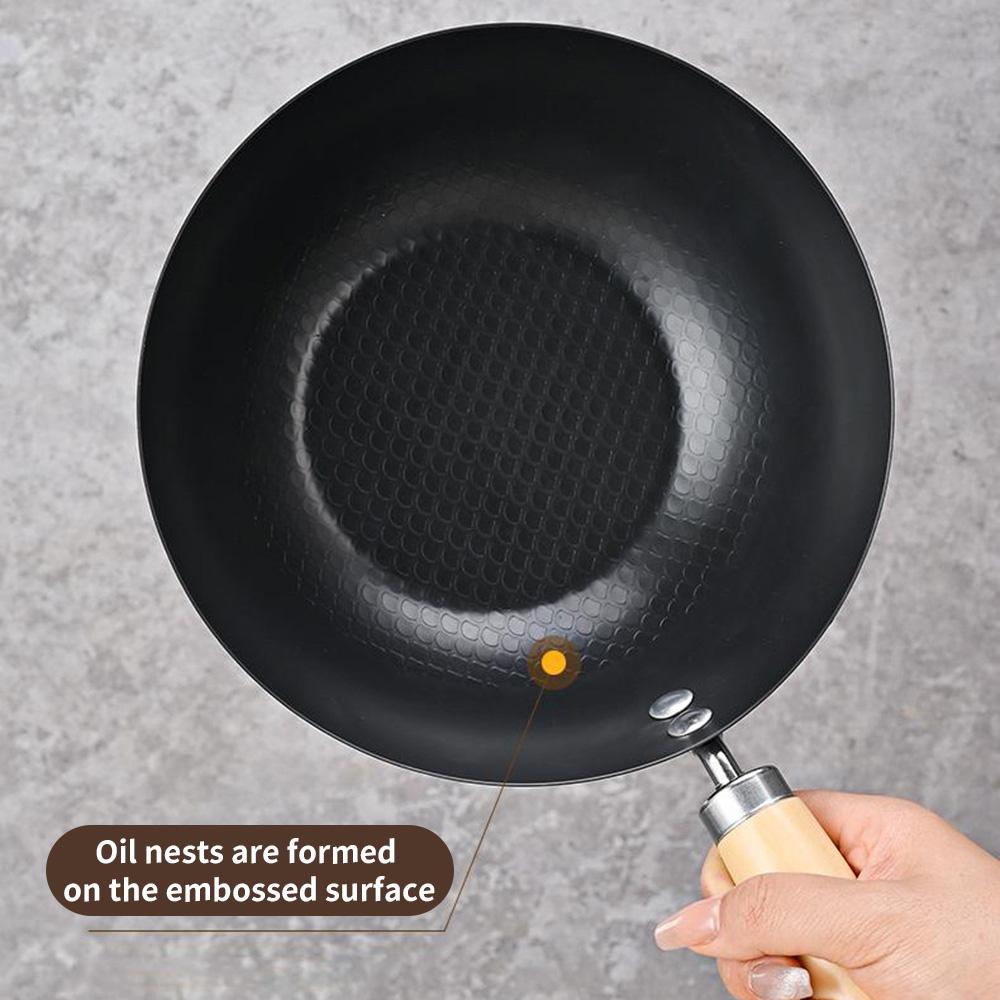 A deep circular, stir fry iron pan, uncoated and non stick pan, compatible with induction cookers