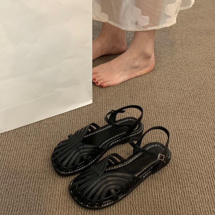 Mori baotou sandals female 2025 summer new fairy wind woven Roman shoes hollow flat bottom pig cage beach shoes