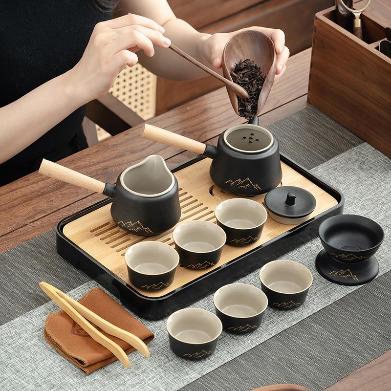 Japanese-style black pottery side handle pot tea set, household high-end ceramic tea set, teapot, teacup, tea tray, complete set of gift boxes