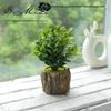 Creative Wooden Basin with Artificial Green Plant Bonsai Ornament for Display and Decoration.