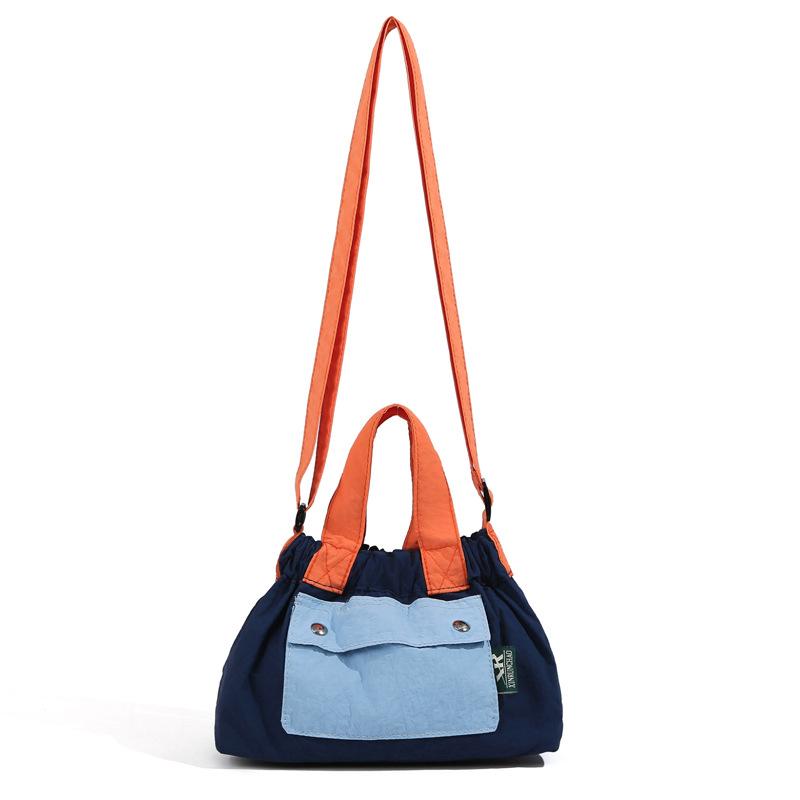 

Nylon bag women s 2025 new women s bag contrasting color small messenger bag travel light handbag to work commuting small bag синій