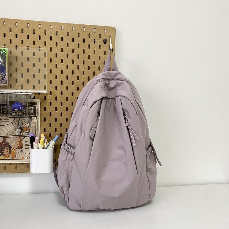 Travel lightweight advanced sense niche backpack college student commuter junior high school girls schoolbag Japanese and Korean simple backpack