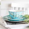 Blaues Porzellan Kaffeetassen- und Untertassenset Bone China Teetasse Pflaumenmuster Kaffeetassen