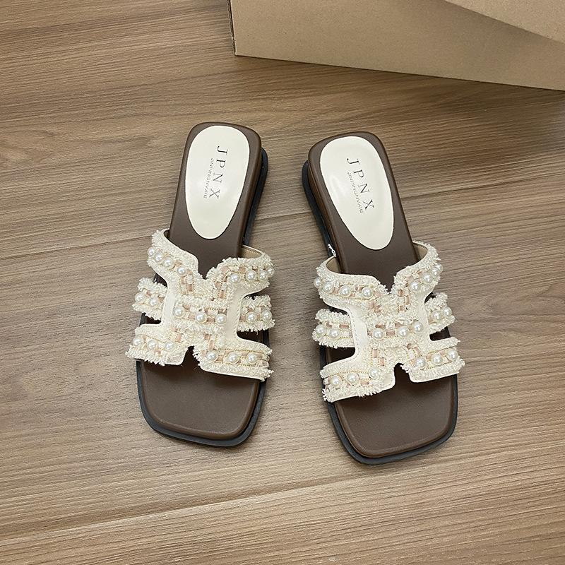 Thick-soled cool slippers for women's summer wear 2025 new beautiful pearl one-word drag with skirt vacation style beach sandals