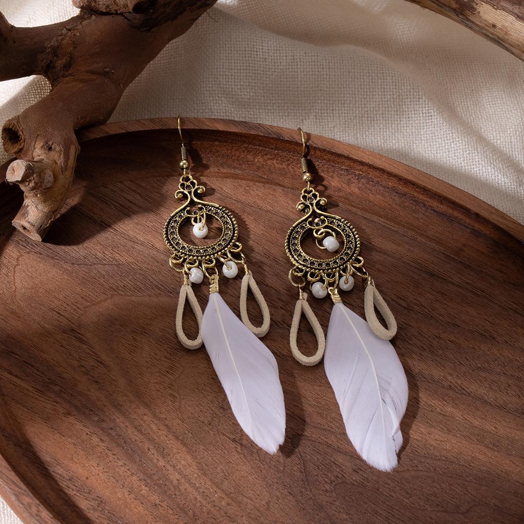 Retro ethnic style woven feathers long fringed earrings, bohemian high-end hollow rice bead earrings