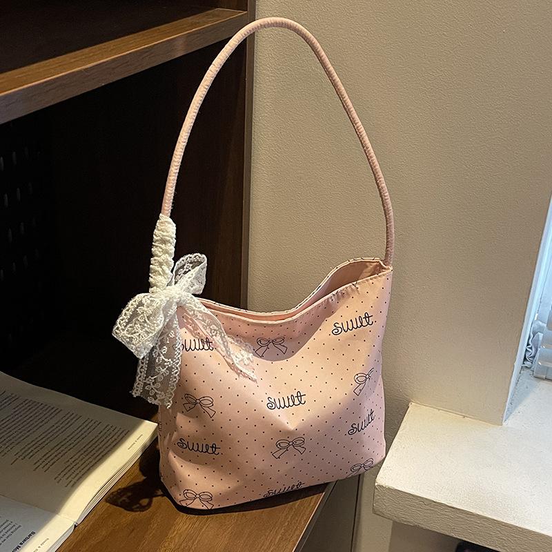 

Нишевая сумка в горошек женская новая универсальная на плечо под мышку для выхода на работу сумка-ведро маленькая сумка розовый