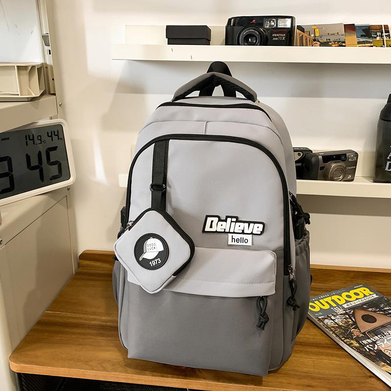

Backpack male college students commuting large-capacity computer travel backpack simple style female junior high school students class bag серый