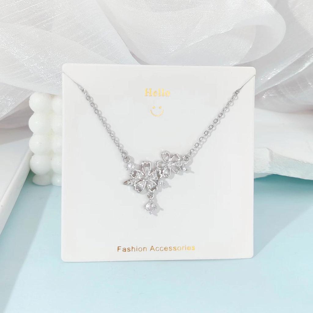 Pink Zircon Gourd Pendant Necklace with Floral Tassels - Titanium Steel Clavicle Chain for Women's Light Luxury.