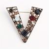 Retro temperament design sense hollow victory V-shaped brooch