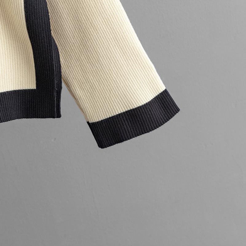 GMXIA Knitwear Set for Women's Autumn Design: A Two-piece Outfit Featuring A Contrasting Color Round-neck Top and A Slit Skirt, Exuding Elegance