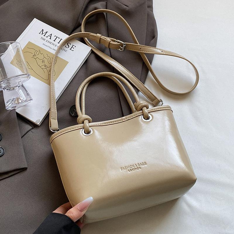 

Весна и лето новая ins простая портативная сумка-ведро корейская повседневная для работы продвинутая сенсорная pu однотонная сумка-мессенджер женская