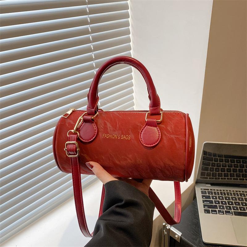 Niche design cylinder handbag new temperament versatile high sense messenger bag fresh and sweet shoulder bag