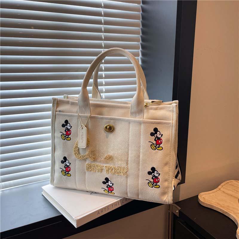 2025 Hot-Selling Large Capacity Canvas Tote: Stylish Commuter & Crossbody Bag.