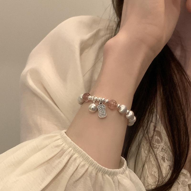 2024 Nový styl Dámský vynikající laserový náramek s křišťálem kočičího oka a jahodovým křišťálem – Módní a všestranný špičkový šperk