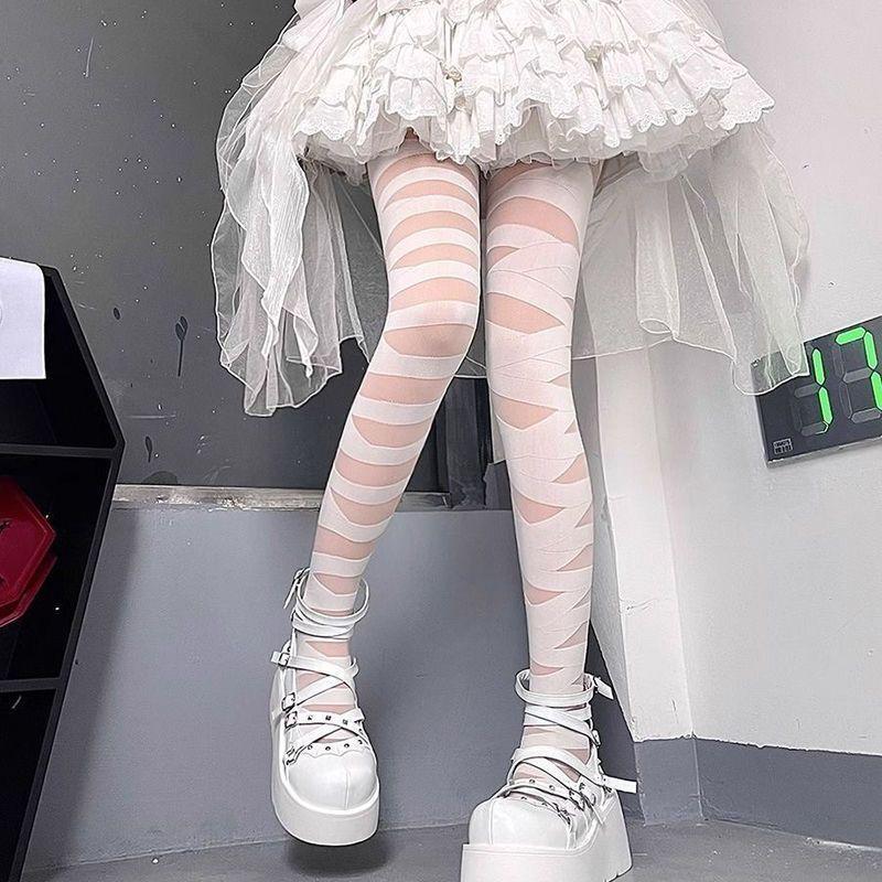 Gothic Punk Cutout Strümpfe: Schwarze zerrissene Netzstrumpfhosen für einen ausgefallenen Subkultur-Stil.