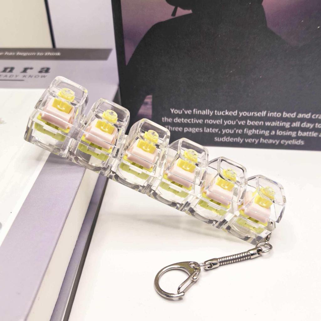 Stummer mechanischer Tastatur-Schlüsselanhänger mit 5,6 Kreuzachsen-Tasten und hochtransparenten Tastenkappen; Dekompression Spielzeug.