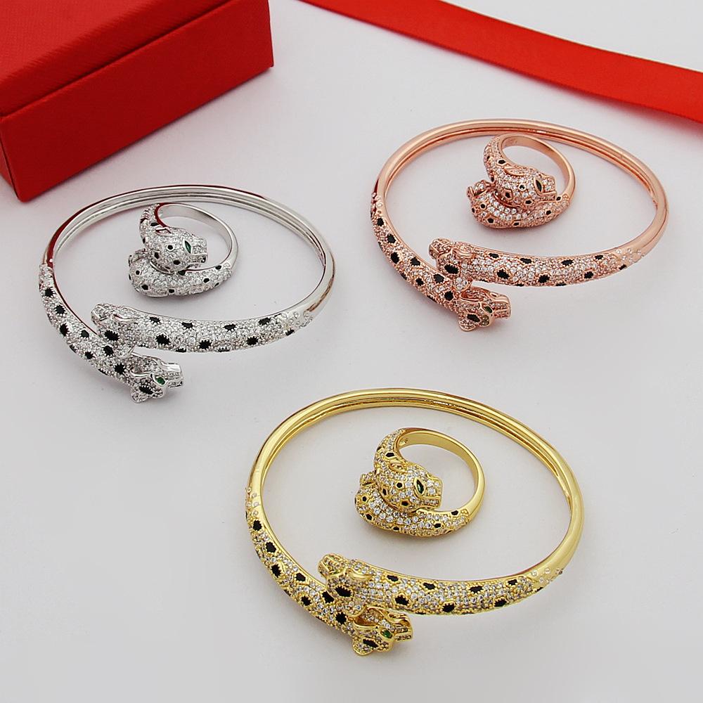 Ah, gold jewelry, green diamond eyes full of diamonds, double leopard open ring, double leopard head full diamond ring, leopard.