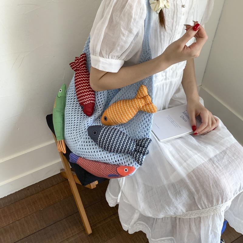 Niche bag women's large-capacity new summer leisure shoulder knitted woven bag commuter tote bag