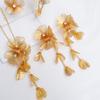 Exquisite 4-Piece Tassel Jewelry Set: Hollow Flower Necklace, Earrings, Bracelet & Ring