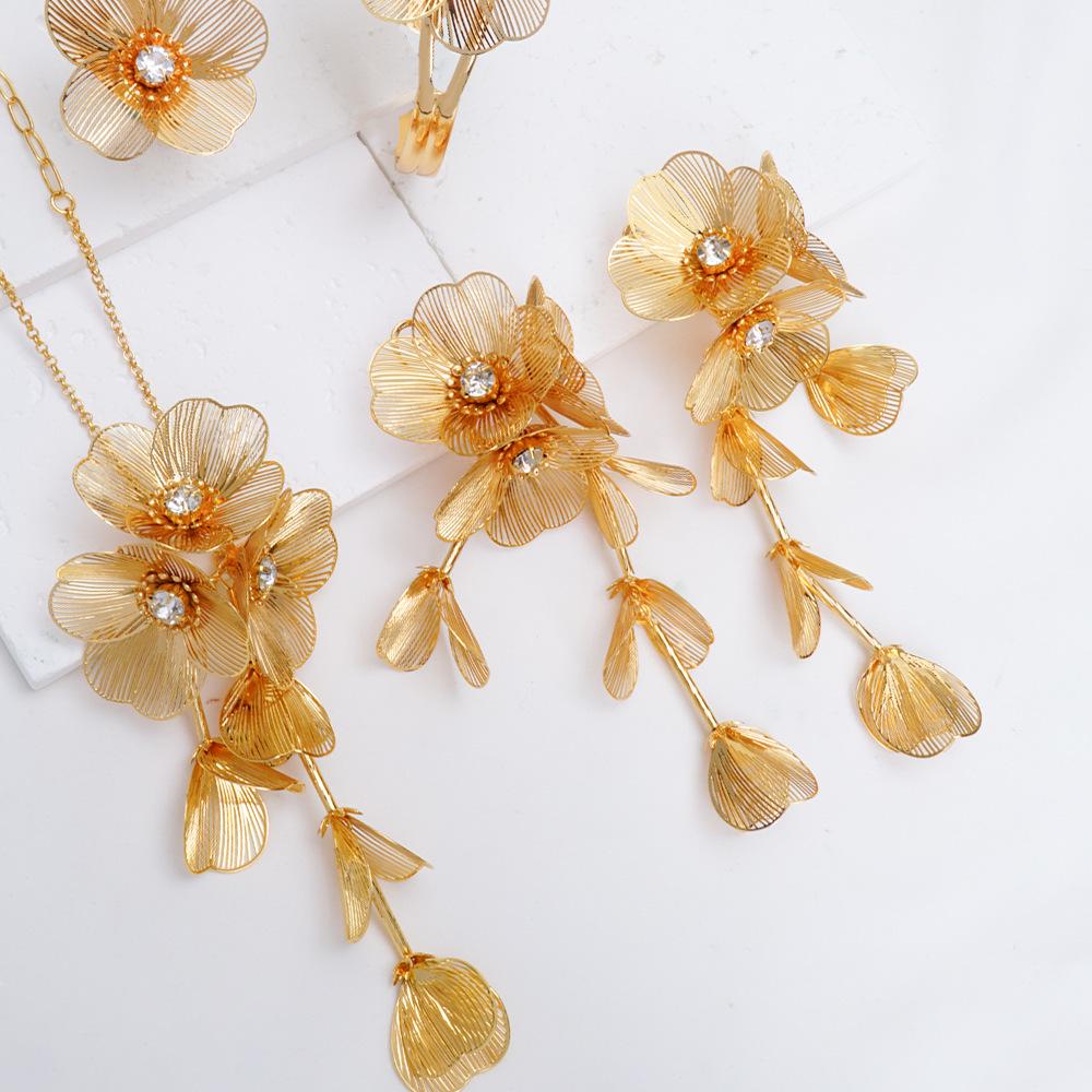 Exquisite 4-Piece Tassel Jewelry Set: Hollow Flower Necklace, Earrings, Bracelet & Ring