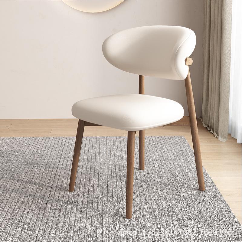 Nordic Modern Minimalist Solid Wood Dining Chair with Soft Pack Backrest - Comfortable Light Luxury Ram's Horn Design for Home, Restaurant, and Hotel.