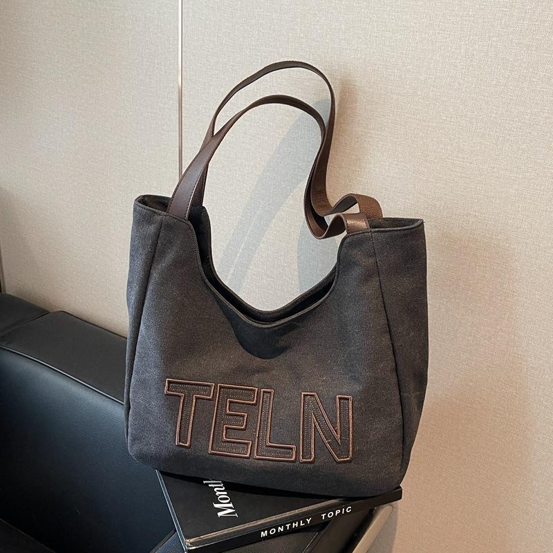 

Large capacity casual alphabet canvas bag women s new versatile simple shoulder bag commuter tote bag чёрный