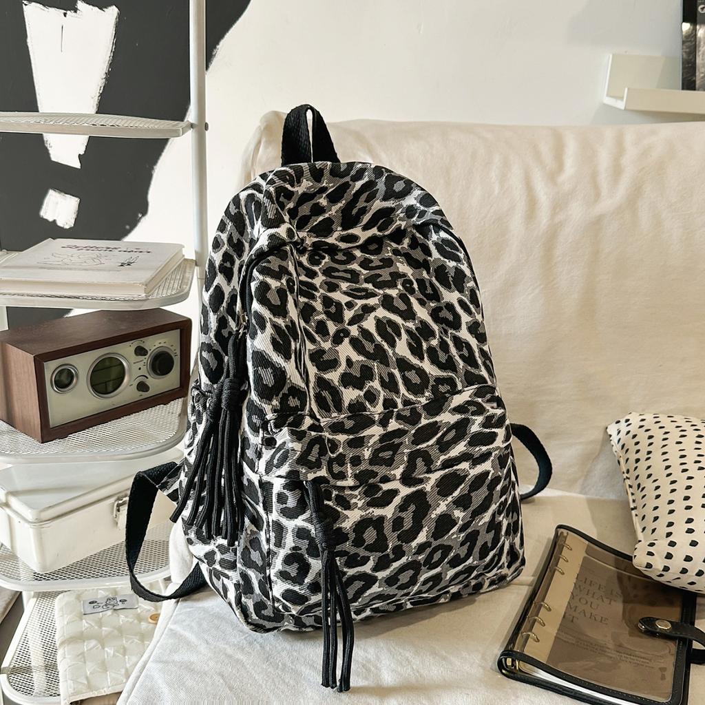 Leopard Print Backpack Casual Daily Use Trendy Street Style Lightweight Backpack for Women with Tassel Detail for School Travel and Everyday Outings
