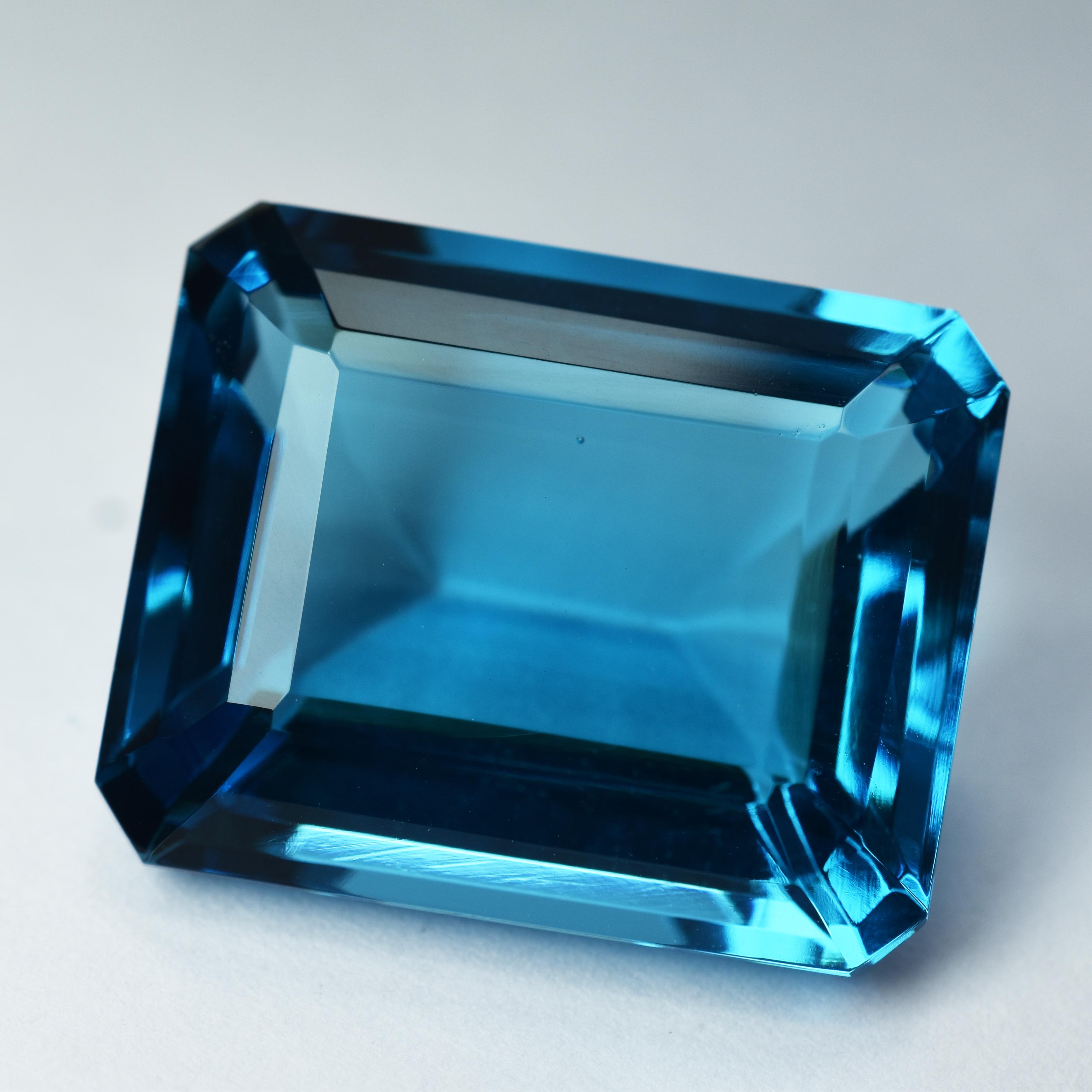 

Lab-Created Teal Sapphire 39.58 Ct CERTIFIED Emerald Cut Blue Loose Gemstone s-98795498 24.2 mm approx синій