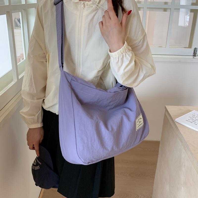 Canvas bag crossbody female Korean version fashionable simple large capacity student class lightweight simple solid color portable shopping bag