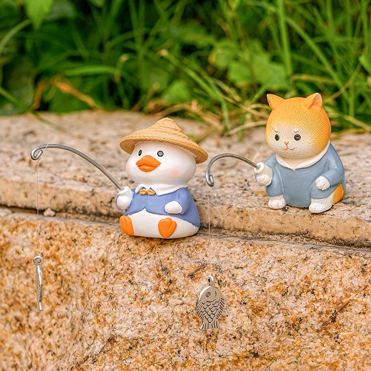 Creative Aquarium Decoration: Cute Animal Fishing Ornaments with Waterfall Rockery for Fish Ponds