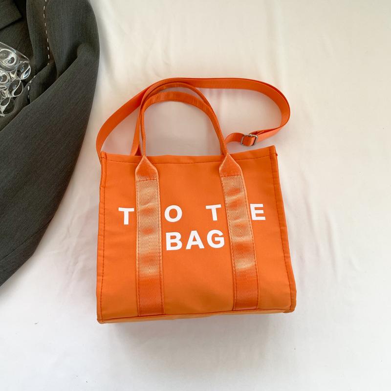 

Печать букв большая вместимость корейская версия сумка для отдыха 2025 ранняя весна новая универсальная ins на плечо мессенджер сумка-тоут оранжевый