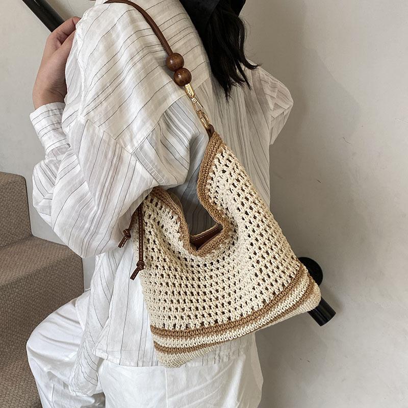 

Женская сумка-тоут 2025 новая большая вместимость студенты колледжа класс плетение мягкая полая пляжная сумка через плечо