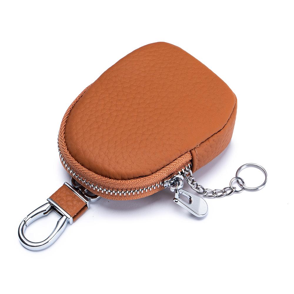Genuine Leather Mini Coin Purse & Key Holder: Multifunctional Cowhide Wallet & Earphone Bag.