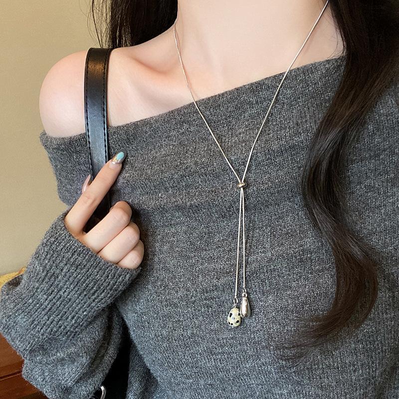 Tiger s eye stone water drop pulling necklace women s 2026 new popular niche design long sweater chain accessories