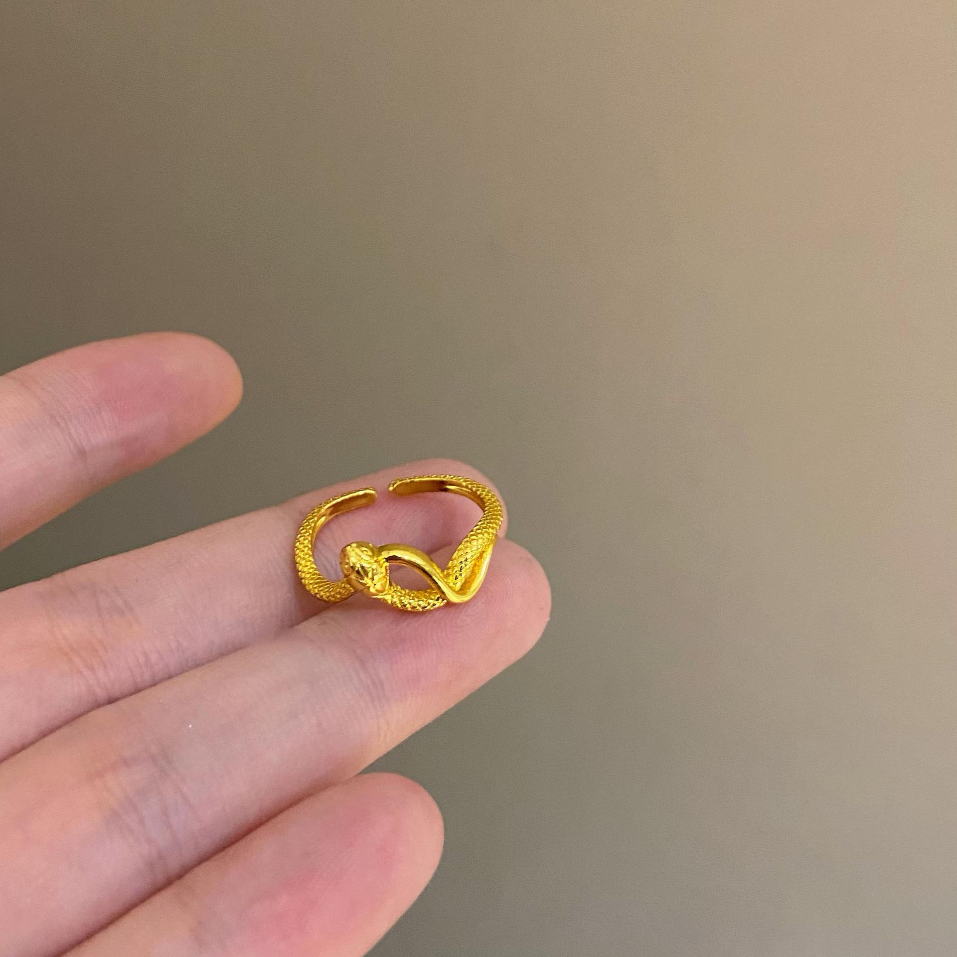 

Golden spirit snake winding open ring female new snake zodiac natal ring fashion high-end food ring