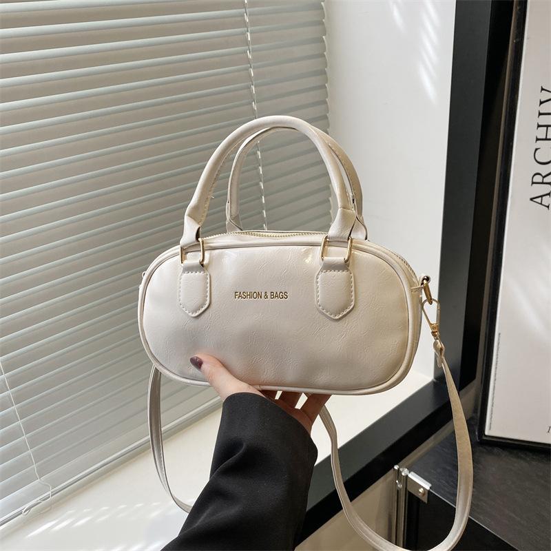 Hand carry fashion tote bag 2025 spring and summer new simple casual shoulder bag high-end trend oblique span bag