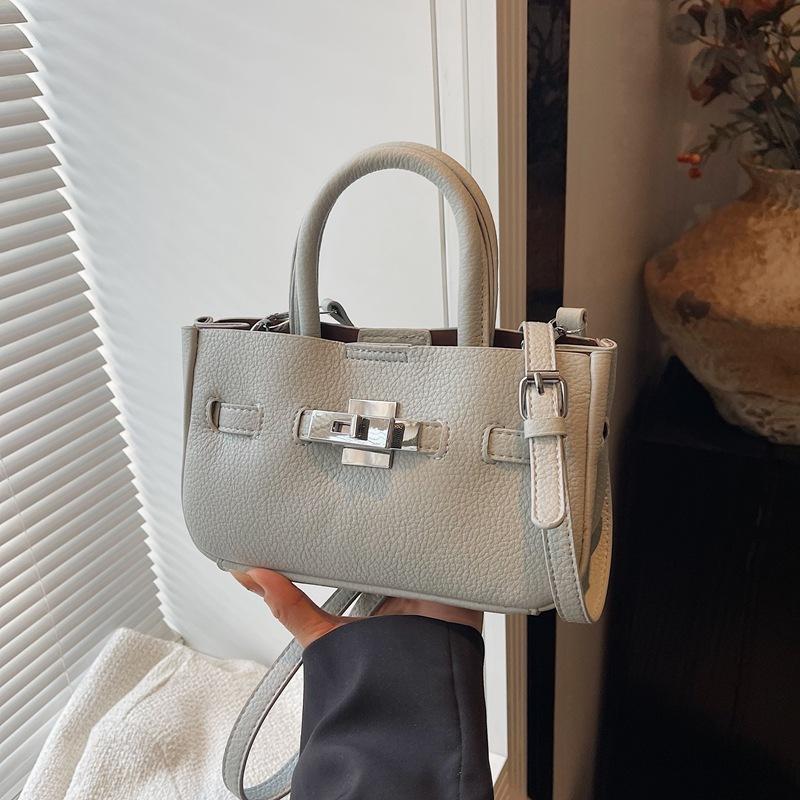 Premium Sense Hand Trage Tasche Damen Neue Mode Einfache Schulter Umhängetasche Nische Pendler Tasche