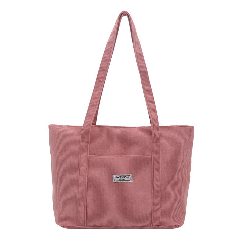 

Casual simple portable tote bag women s autumn new largecapacity shoulder bag commuter casual armpit bag рожевий