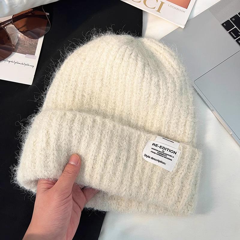 The New Woolen Hat Shows Off Your Face. It's A Trendy Knitted Hat with A Fabric Patch for Warmth Ear Protectors and Headscarves