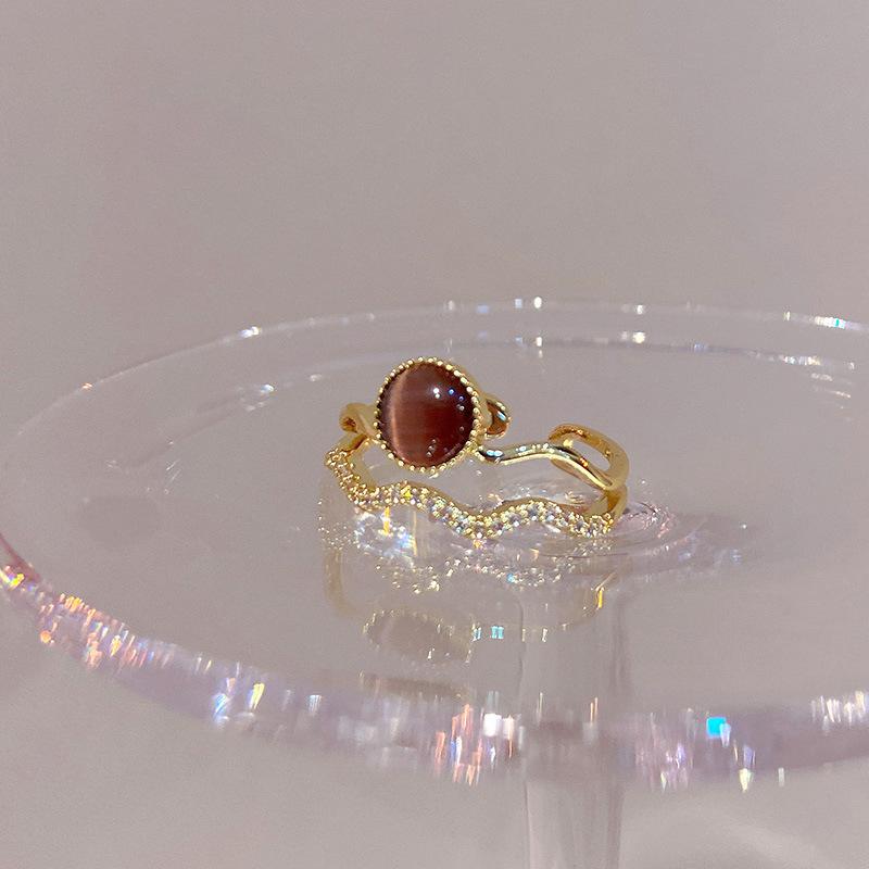 Electroplated Korean artificial opal zir*****pen ring, a sexy index finger ring jewelry.