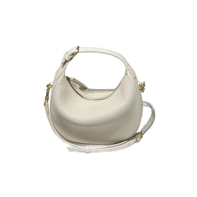 The new crescent-shaped bag, hand-held top layer cowhide women's bag, single-shoulder crossbody genuine leather underarm bag, exudes a sense of luxury