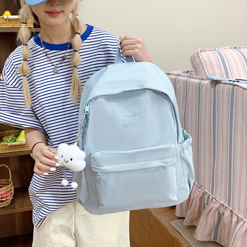 A Simple and Fashionable Backpack with A Large Capacity and A High-quality Texture. It Is A School Bag for Senior High School Students
